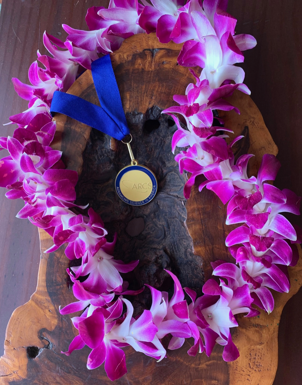 ARCS Scholar medallion with orchid lei
