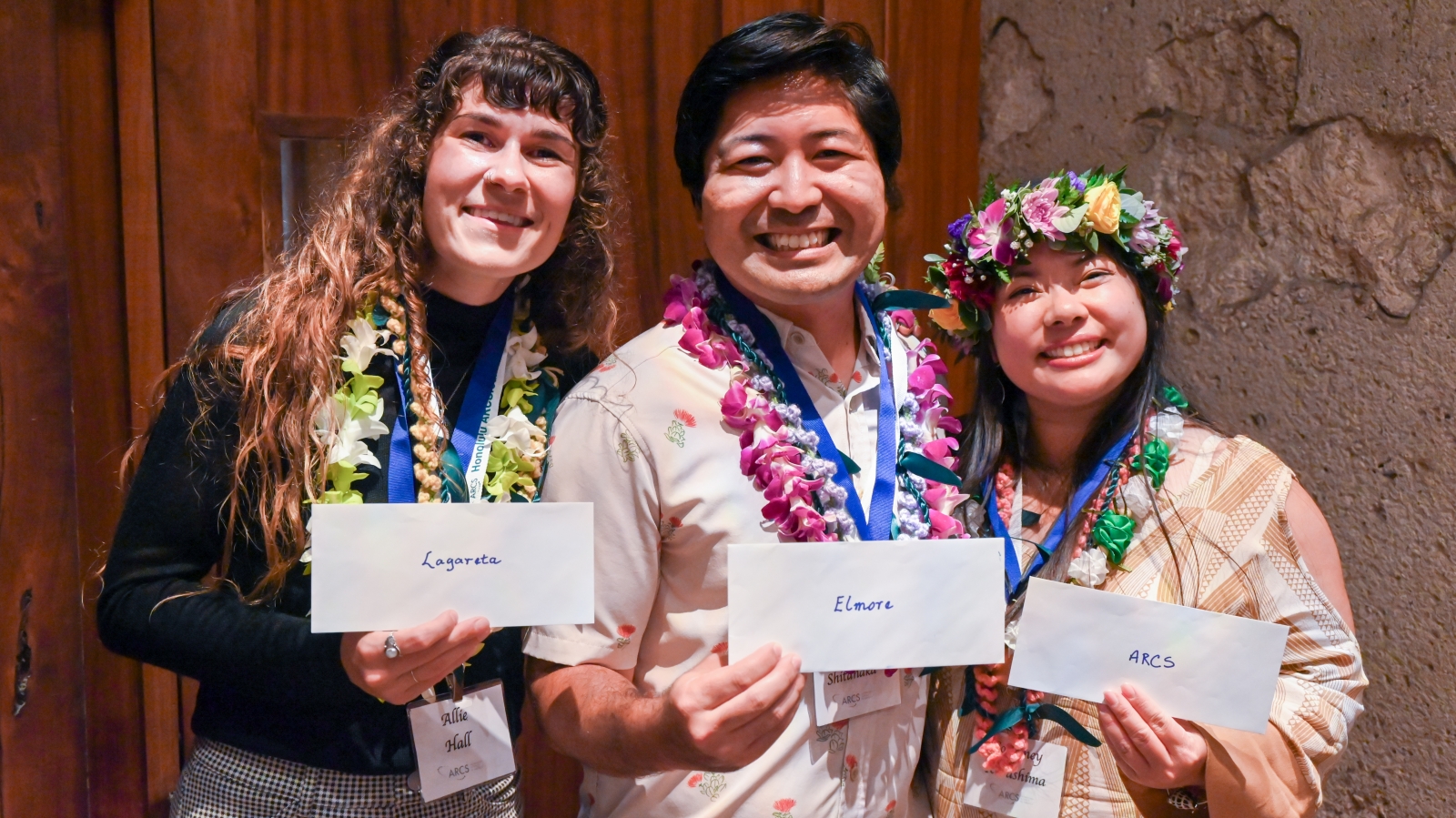 Three scholars with envelopes