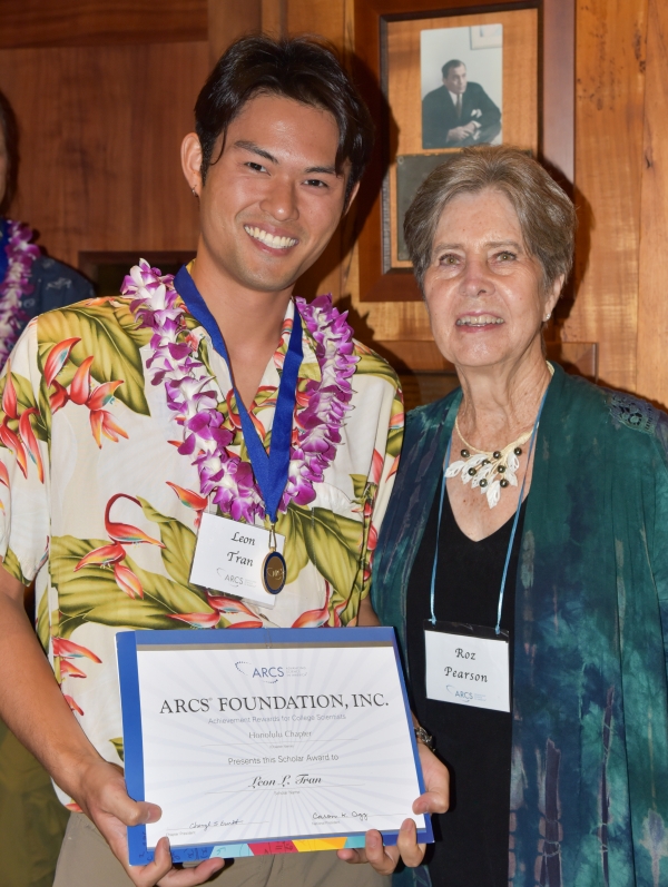Leon Tran with certificate
