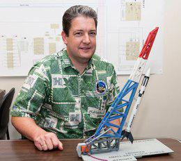 Dr. Luke Flynn Luke Flynn with model of rocket