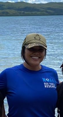 Honolulu ARCS Scholar Sefa Muñoz on previous trip to Guam Sefa Muñoz in cap in front of ocean