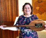 Mariana Gerschenson holding paddle plaque
